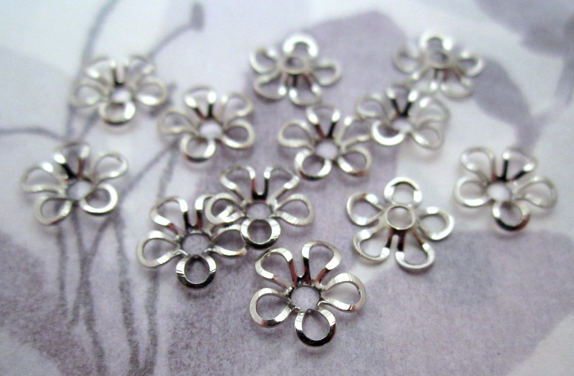 silver tone metal flower beads 9mm at Pitula The Jeweler