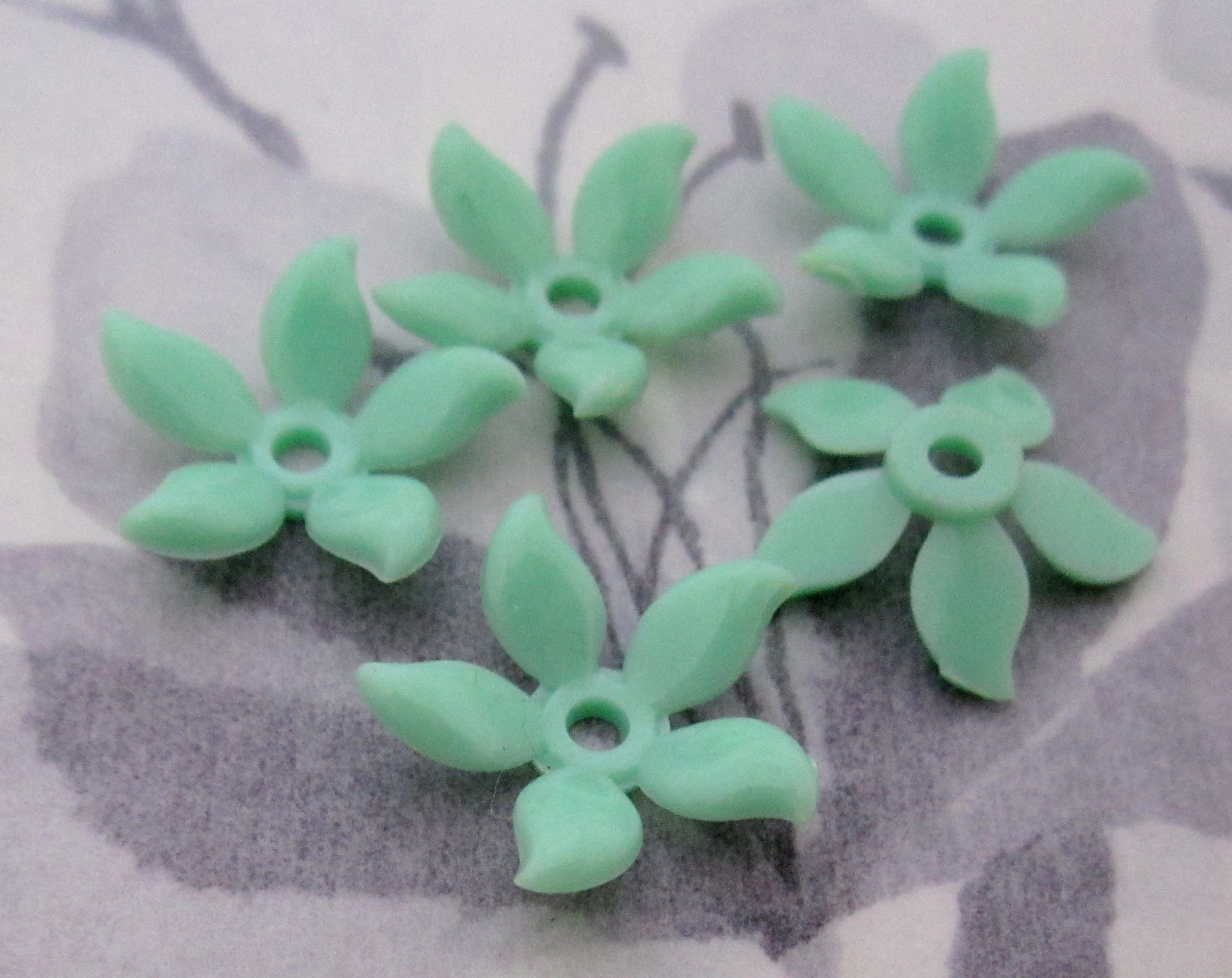 Vintage mint green plastic flower beads at Pitula The Jeweler